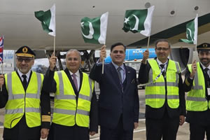 High Commissioner Dr Mohammad Faisal greets Islamabad- London PK785 as PIA lands at London Heathrow Airport after 6 years.